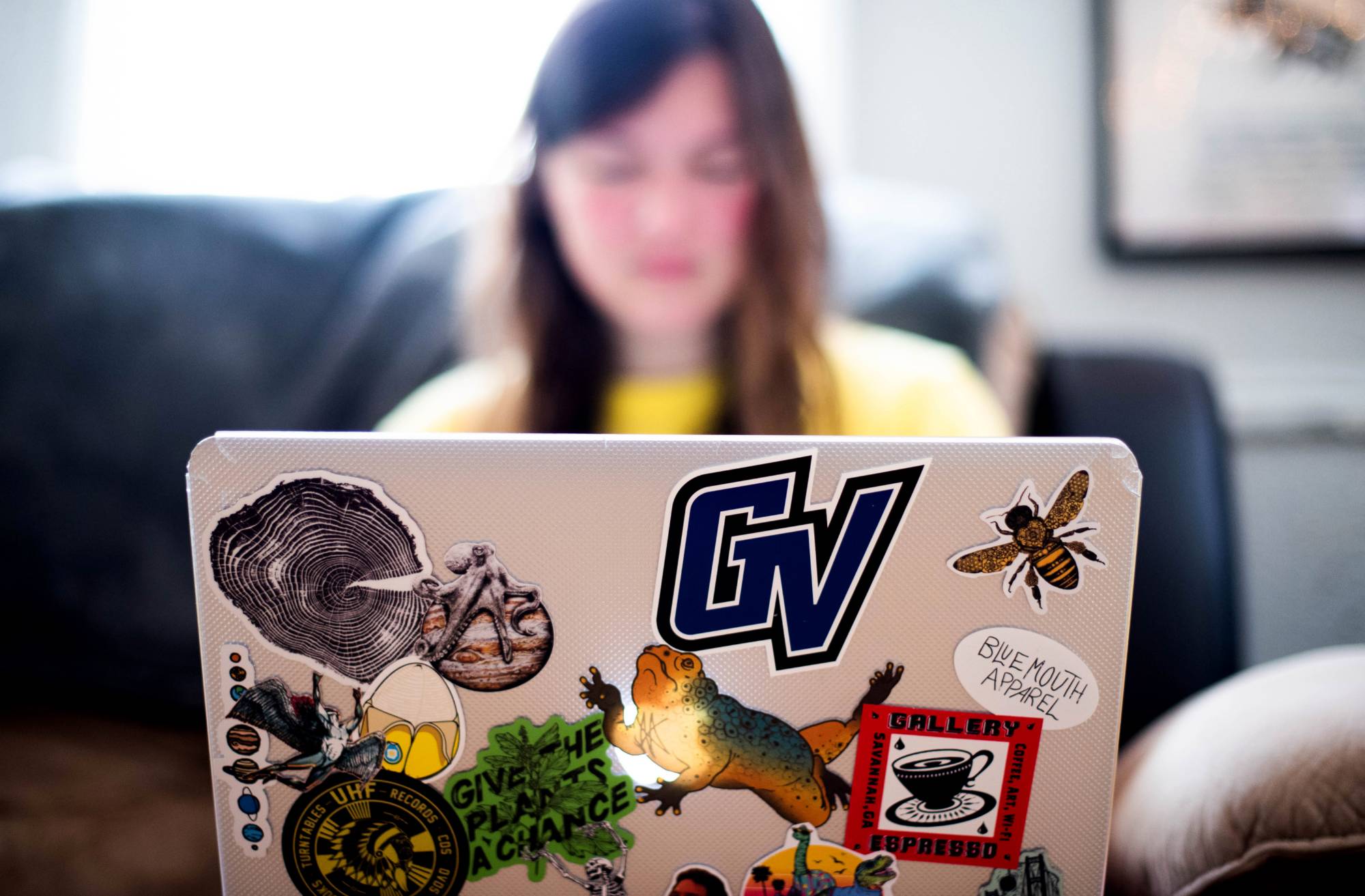 GV student typing on laptop